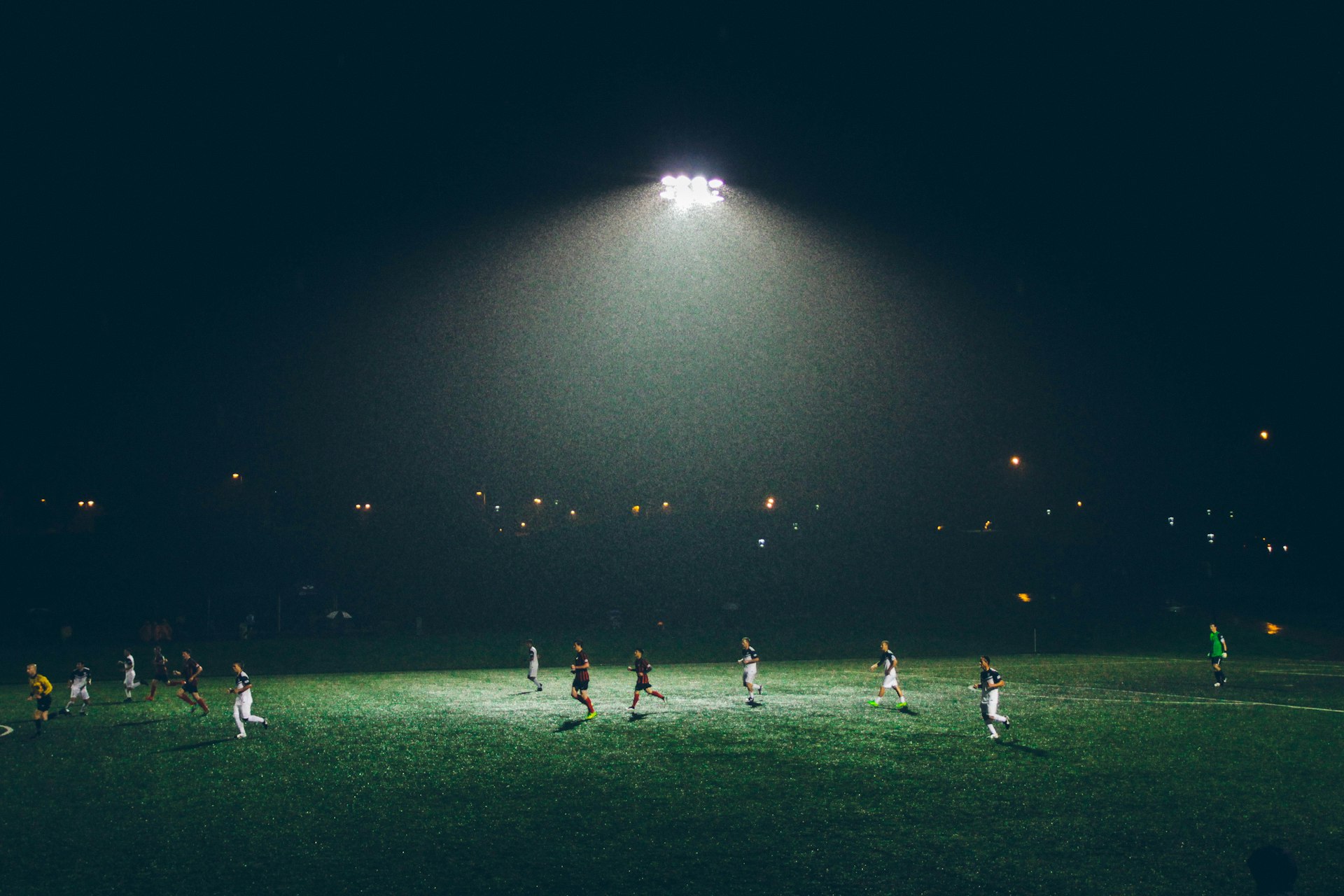 Football match under floodlights
